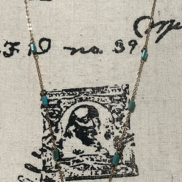 Light gold necklace with round teal threaded pendant, small long beads on chain - Picture 2 of 8